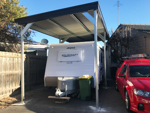 Caravan stored in a skillion carport